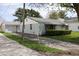 Single-story home featuring light blue siding with detached garage and mature trees at 8341 N Washington St, Sheridan, IN 46069
