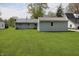 Exterior home view of two outbuildings with large back lawn and well-maintained yard at 8341 N Washington St, Sheridan, IN 46069