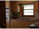 Kitchen with a double sink, cabinet space, tile backsplash and appliances at 8341 N Washington St, Sheridan, IN 46069