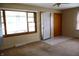 Cozy living room featuring neutral paint, ceiling fan, carpet, and a front door at 8341 N Washington St, Sheridan, IN 46069