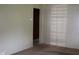 The living room has neutral walls, carpeted flooring, and access to other rooms at 8341 N Washington St, Sheridan, IN 46069