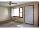 Cozy living room featuring neutral paint, ceiling fan, carpet, and a front door at 8341 N Washington St, Sheridan, IN 46069