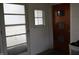 Mud room entrance featuring a translucent glass door, a small window, and solid door with window insets at 8341 N Washington St, Sheridan, IN 46069