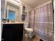 Functional bathroom featuring a shower, toilet, and vanity with storage at 8409 Bolero Way, Camby, IN 46113