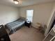 Bedroom featuring carpeted floors, a window, and a bed with a patterned comforter at 8409 Bolero Way, Camby, IN 46113