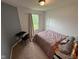 Bedroom with carpet, a window offering natural light, and neutral wall colors at 8409 Bolero Way, Camby, IN 46113