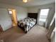 Comfortable bedroom featuring neutral walls, a bed, and a window providing natural light at 8409 Bolero Way, Camby, IN 46113