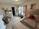 Comfortable bedroom featuring a desk, closet, window, and carpet flooring at 8409 Bolero Way, Camby, IN 46113