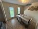 Cozy dining area with a modern table and comfortable seating, illuminated by natural light at 8409 Bolero Way, Camby, IN 46113