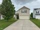 Inviting two-story home with a well-maintained front yard and a two-car attached garage at 8409 Bolero Way, Camby, IN 46113