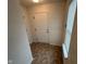 Well-lit foyer featuring tiled floors, a bright window, and a charming white door at 8409 Bolero Way, Camby, IN 46113