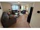 Cozy living room with modern decor, plush seating, and ample natural light at 8409 Bolero Way, Camby, IN 46113