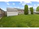 Fenced backyard showcasing a well-kept lawn, storage shed, and partial view of the rear of the house at 901 Palomino Pl, Bargersville, IN 46106