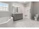 A spacious bathroom featuring a double vanity, soaking tub, and a separate tiled shower at 901 Palomino Pl, Bargersville, IN 46106