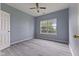 An empty bedroom with fresh paint, modern ceiling fan, and new vinyl floors and natural light at 901 Palomino Pl, Bargersville, IN 46106