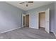 An empty bedroom with fresh paint, modern ceiling fan, and new vinyl floors at 901 Palomino Pl, Bargersville, IN 46106