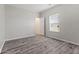 An empty bedroom with fresh paint, modern ceiling fan, and new vinyl floors and natural light at 901 Palomino Pl, Bargersville, IN 46106