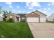 Charming single-story home with brick accents, two-car garage, and well-manicured lawn at 901 Palomino Pl, Bargersville, IN 46106