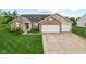Charming single-story home with brick accents, two-car garage, and well-manicured lawn at 901 Palomino Pl, Bargersville, IN 46106