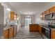 A kitchen featuring stainless steel appliances, granite countertops and wooden cabinets at 901 Palomino Pl, Bargersville, IN 46106
