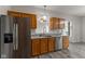 This kitchen features stainless steel appliances, granite countertops, and oak cabinets at 901 Palomino Pl, Bargersville, IN 46106