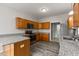 Updated kitchen featuring stainless appliances, oak cabinets, and granite countertops at 901 Palomino Pl, Bargersville, IN 46106