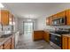 A bright kitchen features stainless steel appliances, granite countertops and wooden cabinets at 901 Palomino Pl, Bargersville, IN 46106