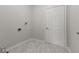 Clean laundry room with tile flooring and utility connections at 901 Palomino Pl, Bargersville, IN 46106
