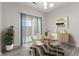 Dining room with modern decor and lighting, featuring hardwood floors at 901 Palomino Pl, Bargersville, IN 46106