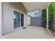 A covered back patio with a sliding glass door overlooking a fenced-in yard at 901 Palomino Pl, Bargersville, IN 46106