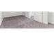 Bedroom featuring neutral walls, gray carpet, and closet access, with an interior door at 920 E 62Nd St # Apt M7, Indianapolis, IN 46220