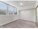 Empty bedroom with neutral carpet, large windows with blinds, and recessed lighting at 920 E 62Nd St # Apt M7, Indianapolis, IN 46220