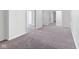 Spacious bedroom with gray carpet, multiple doors, and ample closet space, perfect for comfort and organization at 920 E 62Nd St # Apt M7, Indianapolis, IN 46220