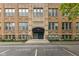 Exterior shot of a well-maintained brick building with prominent 'School 65' signage above the entrance at 920 E 62Nd St # Apt M7, Indianapolis, IN 46220