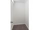 Walk-in closet featuring neutral walls, a single light fixture, gray carpet, and ample vertical space at 920 E 62Nd St # Apt M7, Indianapolis, IN 46220