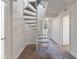 Hallway with a carpeted spiral staircase leading upwards, enhanced by natural light from a skylight at 920 E 62Nd St # Apt M7, Indianapolis, IN 46220