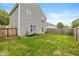 Well-maintained backyard featuring a fenced yard, green lawn, and a cozy exterior elevation at 9307 W Dockside Cir, Pendleton, IN 46064