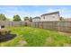 Spacious backyard with a wood fence, manicured lawn, and a beautiful landscape at 9307 W Dockside Cir, Pendleton, IN 46064