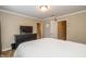 Bright bedroom featuring modern decor, a comfortable bed, and a large flatscreen TV at 9307 W Dockside Cir, Pendleton, IN 46064