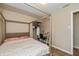 Comfortable bedroom featuring a stylish canopy bed, a desk, and hardwood floors at 9307 W Dockside Cir, Pendleton, IN 46064