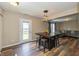 Dining area featuring a large table with seating and seamless access to the backyard through a glass door, ideal for entertaining at 9307 W Dockside Cir, Pendleton, IN 46064