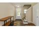 Bright foyer with modern flooring, a staircase, and a view of the front door, creating an open and welcoming entry at 9307 W Dockside Cir, Pendleton, IN 46064