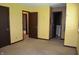 A bedroom with yellow walls and a view into the on-suite bathroom at 931 Beech Dr, Greenwood, IN 46142