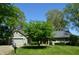 Well-maintained one-story home featuring mature trees and a lush green lawn at 931 Beech Dr, Greenwood, IN 46142