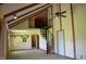 Spacious living room showcasing a unique spiral staircase, vaulted ceilings, and ample natural light at 931 Beech Dr, Greenwood, IN 46142