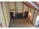 High-angle view of a living room with a brick fireplace, wooden cabinets, and vaulted ceilings at 931 Beech Dr, Greenwood, IN 46142
