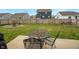 Large backyard with a patio, fire pit, wooden fence, hammock, and exterior furnishings at 932 Sagittarius Ave, Franklin, IN 46131