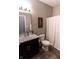 Neutral bathroom with a shower, toilet, and vanity with marble countertop at 932 Sagittarius Ave, Franklin, IN 46131