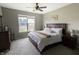 Serene bedroom with a queen-sized bed, soft lighting, and neutral tones at 932 Sagittarius Ave, Franklin, IN 46131