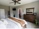 Comfortable Primary bedroom boasts large windows, ceiling fan, and carpeted flooring at 932 Sagittarius Ave, Franklin, IN 46131